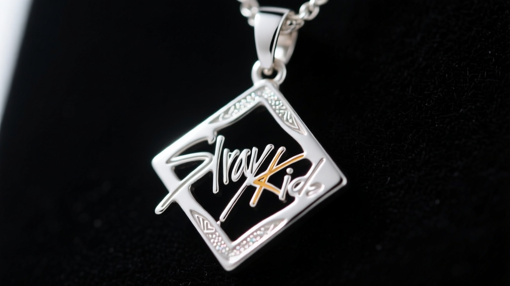 Macro shot of a 925 sterling silver Stray Kids member symbol pendant showing intricate engravings and a high polish mirror finish