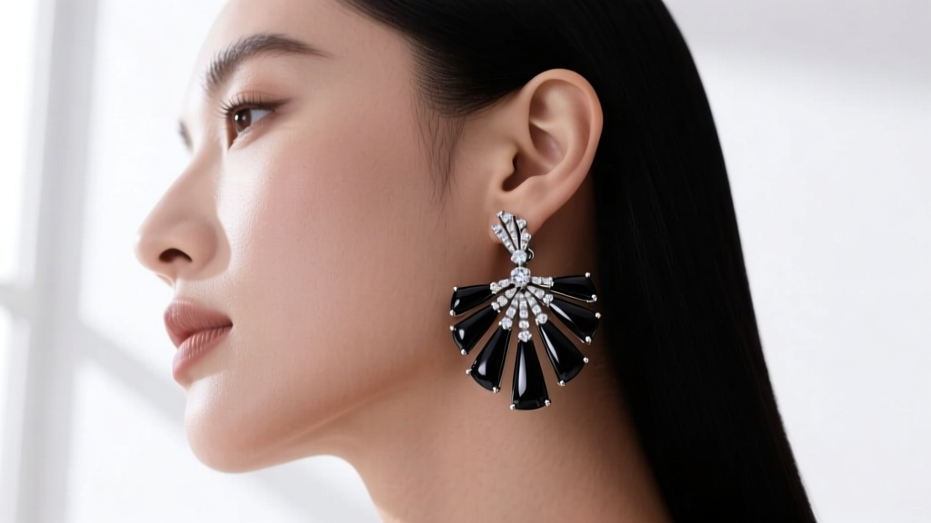 Side profile of a woman wearing black onyx and diamond Divas Dream earrings, showing the articulated fan joints and lobe fit.