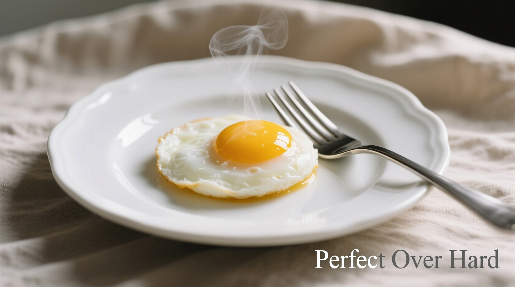Perfect over hard eggs on white plate with fork