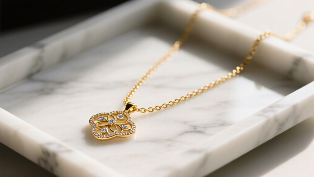 Close-up of the Miranda Frye Stephanie necklace on a marble tray, highlighting the 14k gold-filled chain and delicate pendant.