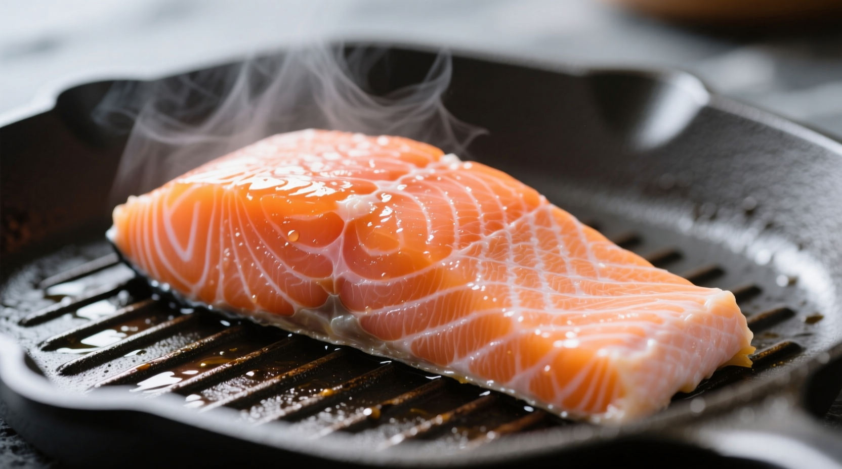 Perfectly cooked salmon fillet showing opaque orange-pink color and flake texture