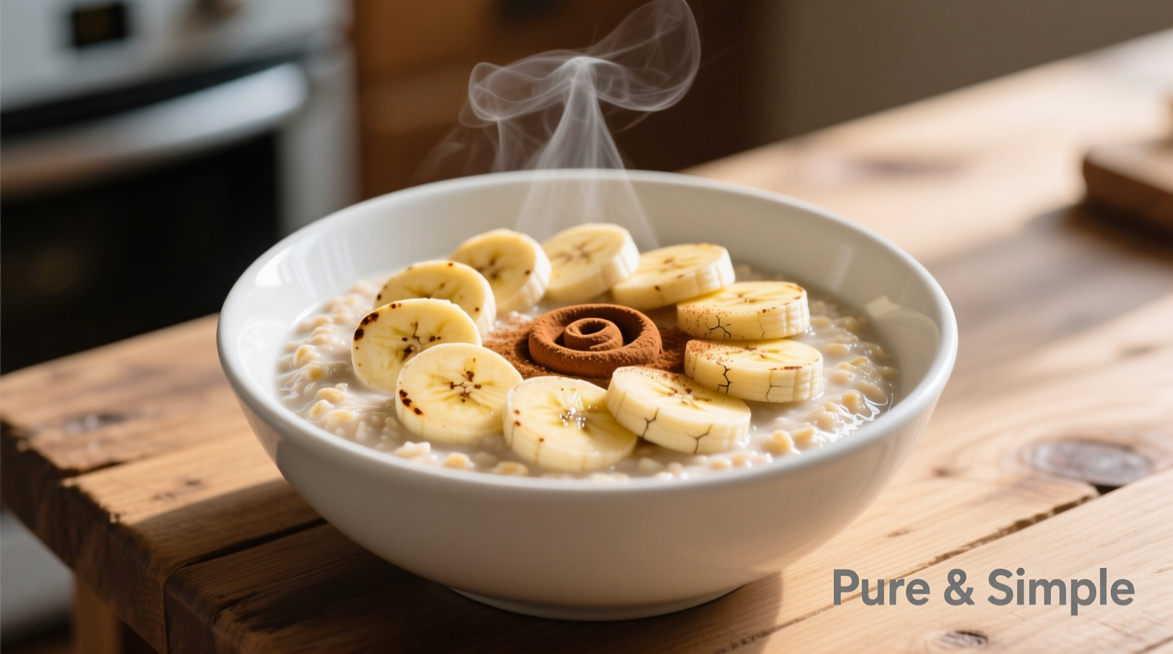 Perfect creamy oatmeal in white bowl with banana slices