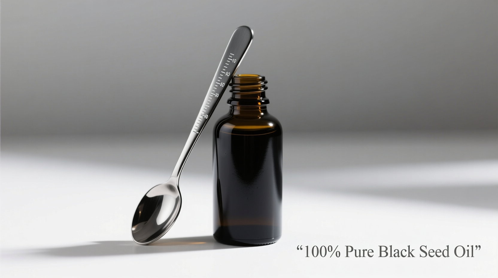 Black seed oil bottle with measuring spoon