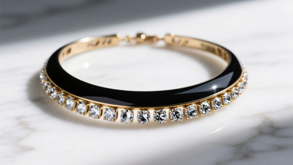 Close-up of a black enamel and crystal statement necklace showing minor wear on brass plating, laid flat on white marble.