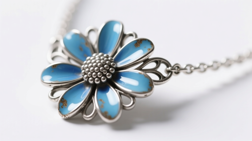 Macro shot of an oxidized silver daisy necklace with blue enamel petals, showcasing intricate metalwork and modern jewelry trends