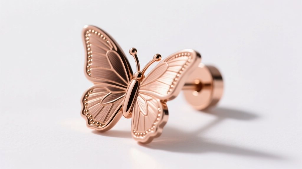 Macro shot of a 20-gauge rose gold butterfly earring post with a secure silicone friction backing on a pure white background.