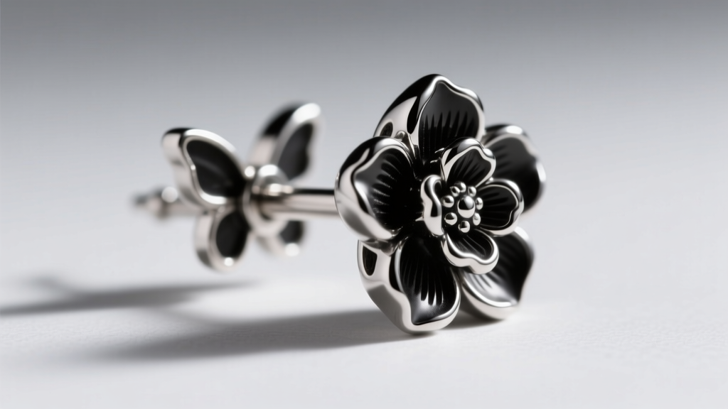 Macro shot of black rhodium plated sterling silver floral earring post, showing the 18-gauge thickness and secure butterfly back.