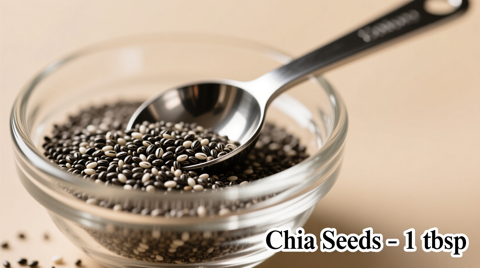 Chia seeds in glass bowl with measuring spoon