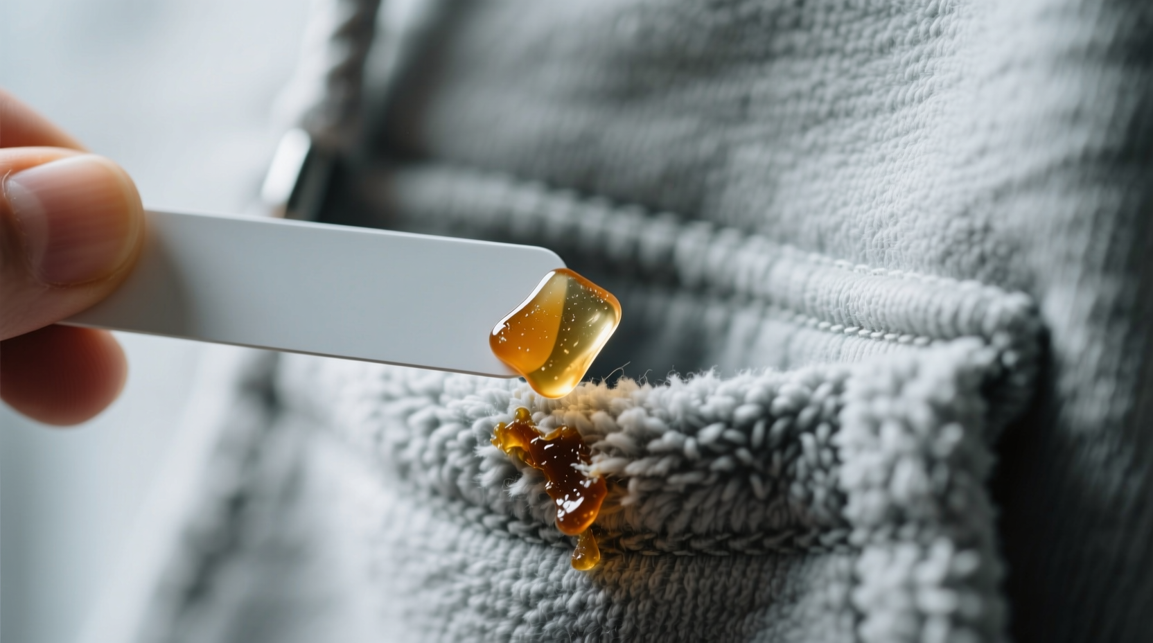 how to remove dried gum from hoodie pockets