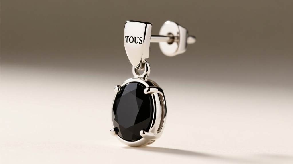 Side view of TOUS silver and onyx drop earring, showing the secure leverback clasp mechanism and a seamless bezel stone setting.