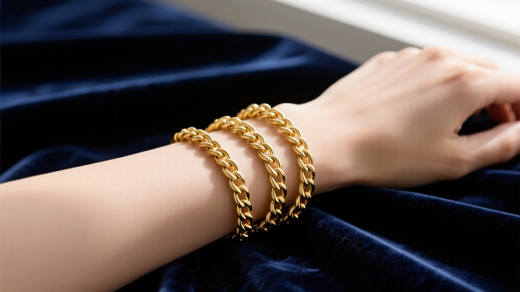 Elegant flat lay of a 30-inch 14k gold filled cable chain necklace wrapped three times around a wrist on dark velvet