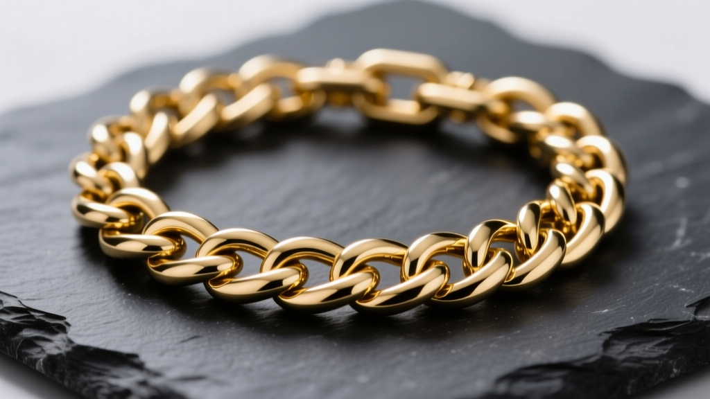 Macro shot of a gold bonded Cuban link chain on dark slate, showing interlocking links and high polish under soft studio light.