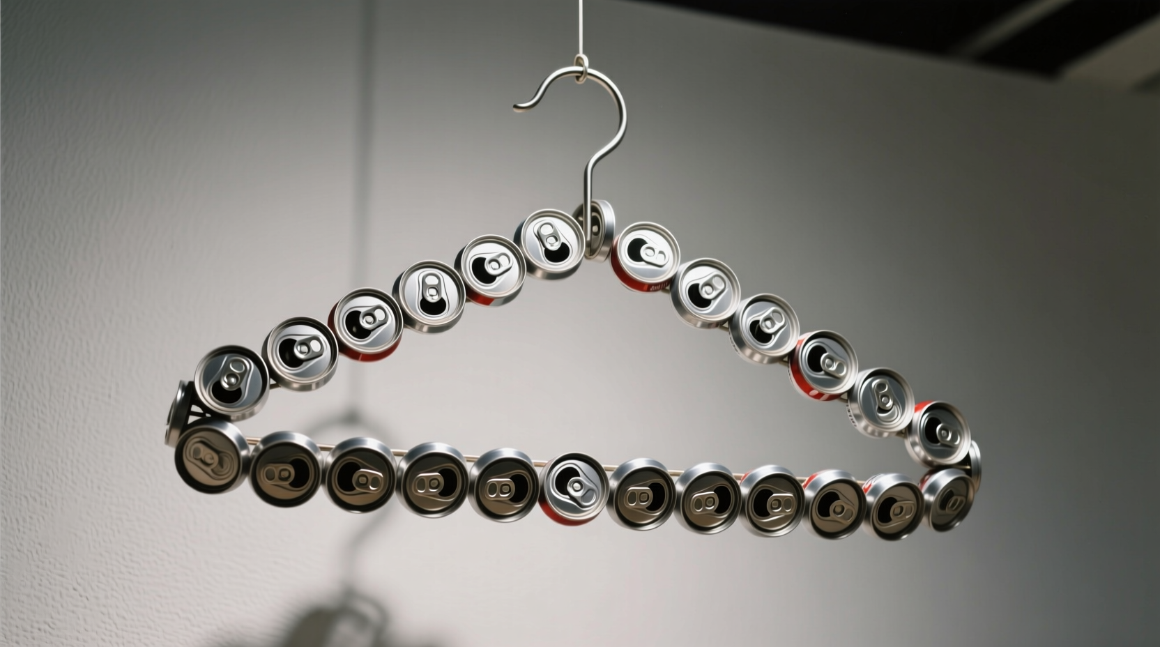 use soda can tabs to create double coat hangers keep s