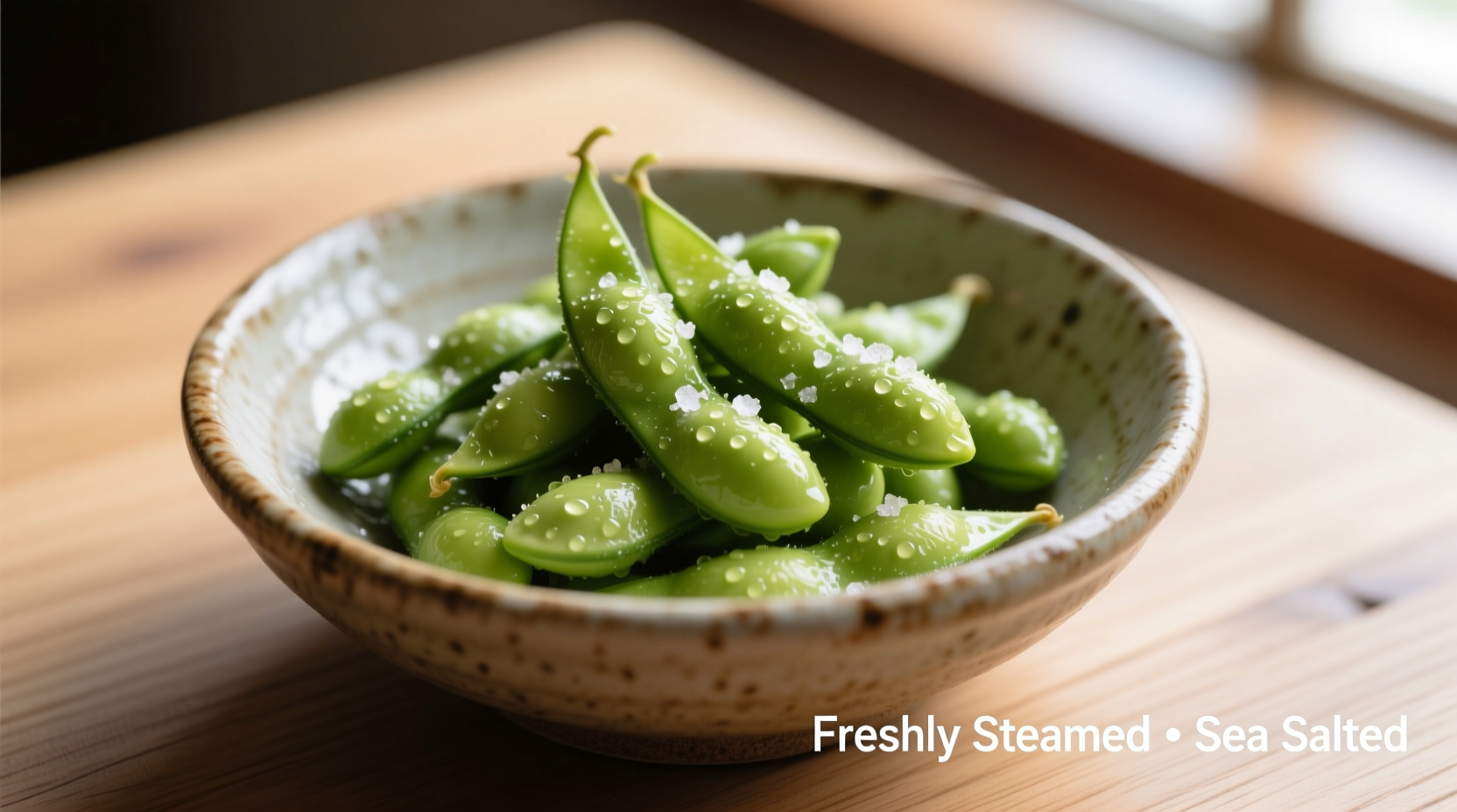 Perfectly cooked edamame in bowl with sea salt