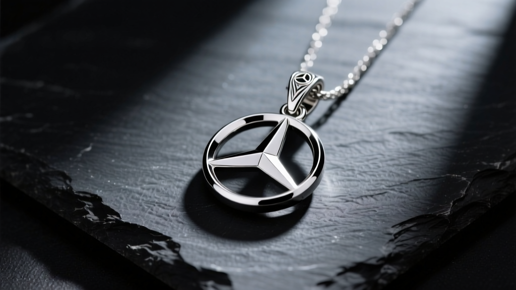 Polished 925 sterling silver Mercedes three-pointed star pendant resting on dark slate, illuminated by dramatic studio lighting.