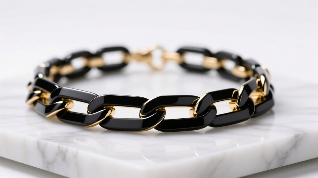Macro shot of a black resin and gold-tone link statement necklace resting on white marble under soft, diffused studio lighting.