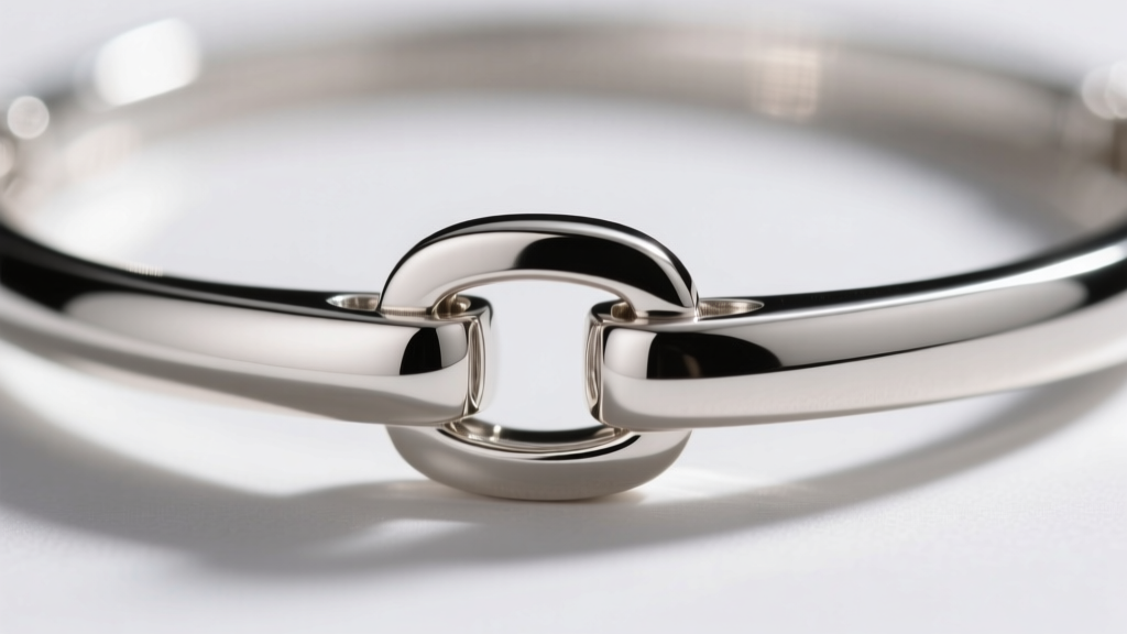 Macro shot of a magnetic clasp on a sterling silver collar necklace, highlighting the interlocking mechanism and high metal polish