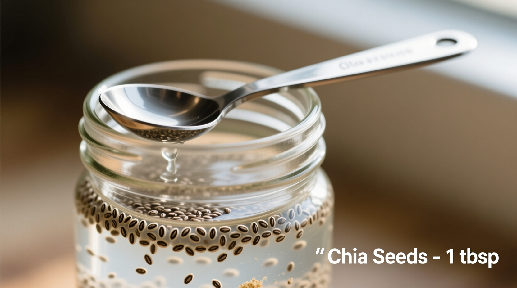 Chia seeds soaked in mason jar with measuring spoon