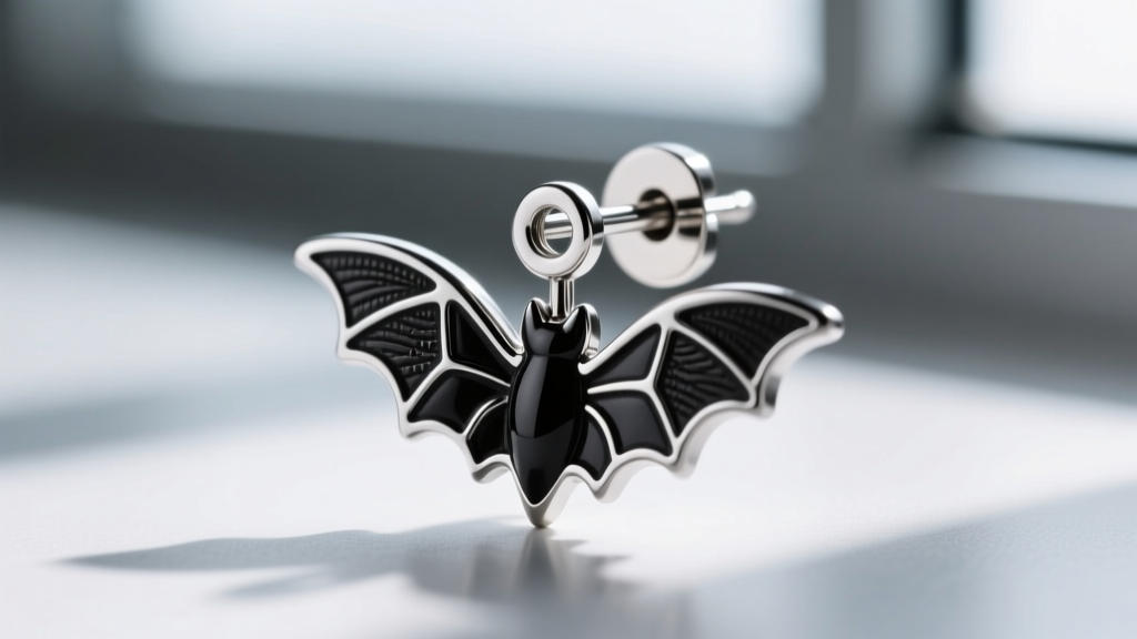 Macro shot of a 316L surgical steel earring post with a black rhodium plated bat charm and a secure metal butterfly backing