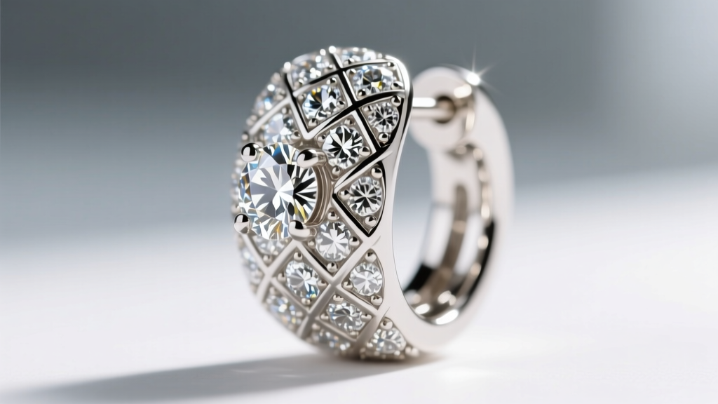 Macro photography of diamond pavé set into the quilted grooves of an 18k white gold Coco Crush earring under a loupe