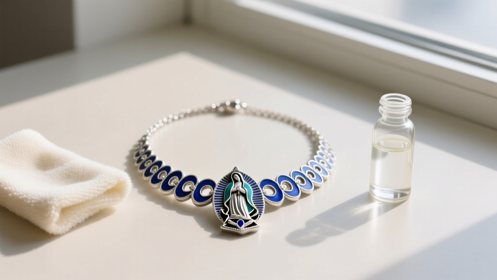 Flat lay of a sterling silver and blue enamel Guadalupe necklace next to a polishing cloth and gentle jewelry cleaning solution