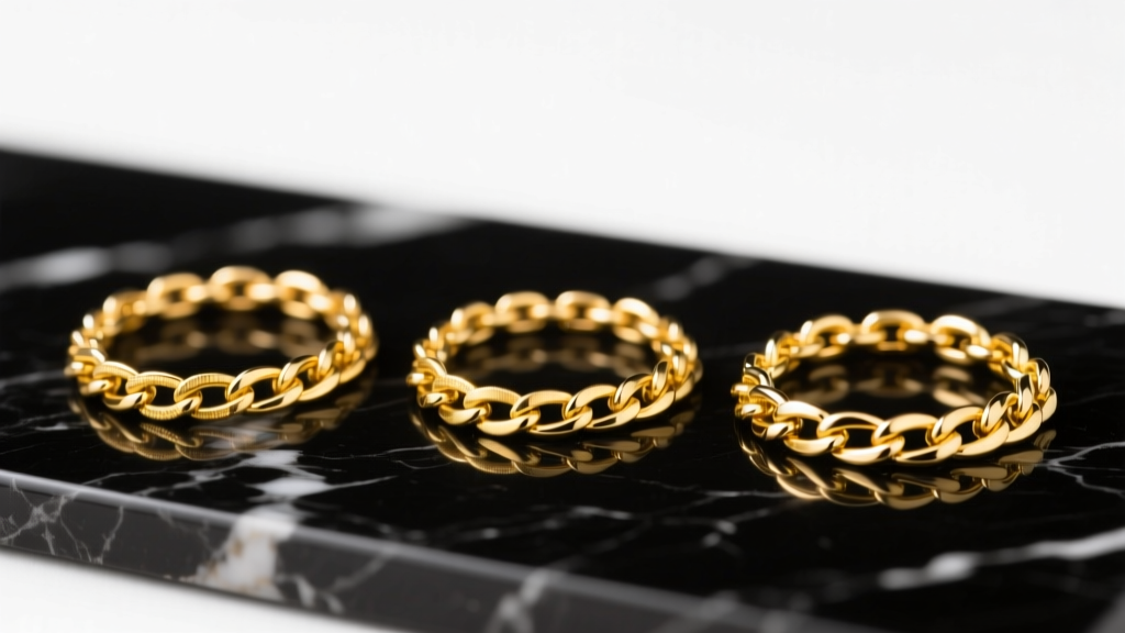 Three chains side-by-side showing color differences between 10k, 14k, and 18k yellow gold alloys under bright studio lighting
