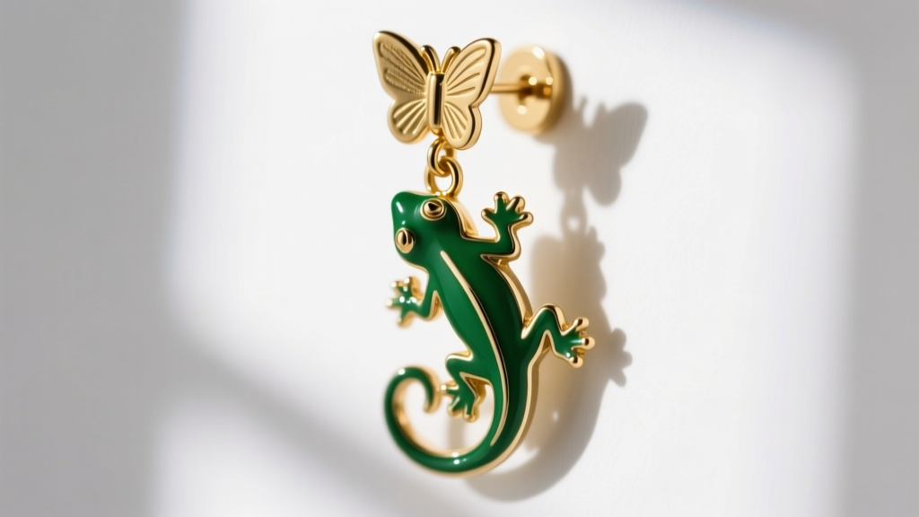 Close-up of green enamel lizard drop earring, focusing on gold-plated brass backing and a secure butterfly clutch mechanism