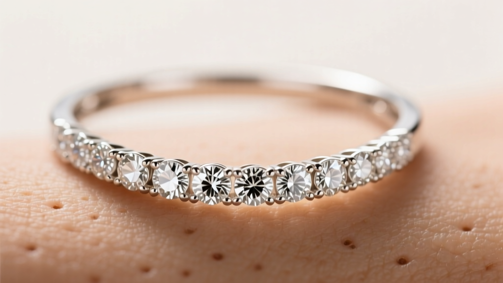 Macro shot of an 18k white gold eternity diamond necklace on skin, showing round diamonds in seamless shared prong settings.