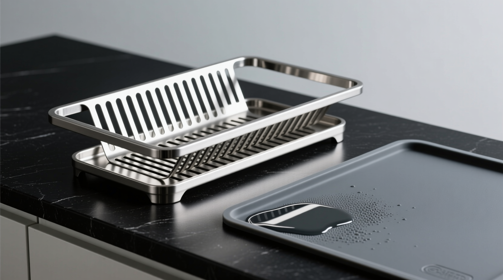 Side-by-side comparison: a slim, angled stainless steel dish rack with visible airflow gaps above a matte-black countertop, next to a saturated gray silicone mat with visible water pooling at its base and subtle discoloration along the edge