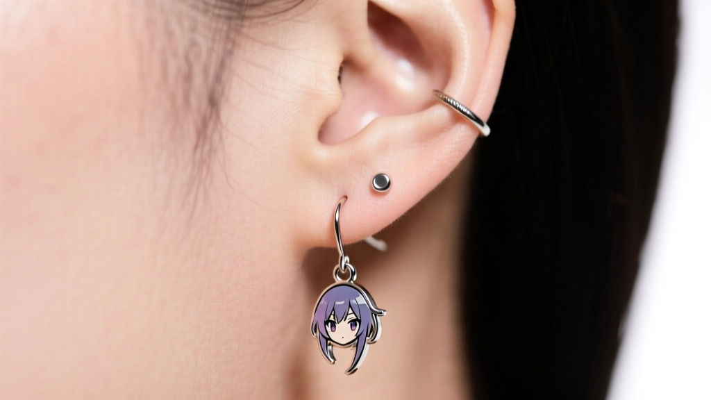 Ear lobe wearing an 18-gauge anime drop earring, showing proper weight distribution and a secure silicone back.