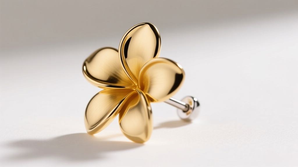 Side profile of a gold vermeil plumeria drop earring, highlighting the sterling silver post and thick gold plating on the petals.