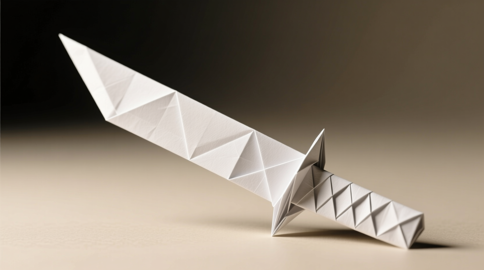 Folding paper diagonally to create triangle base for kunai