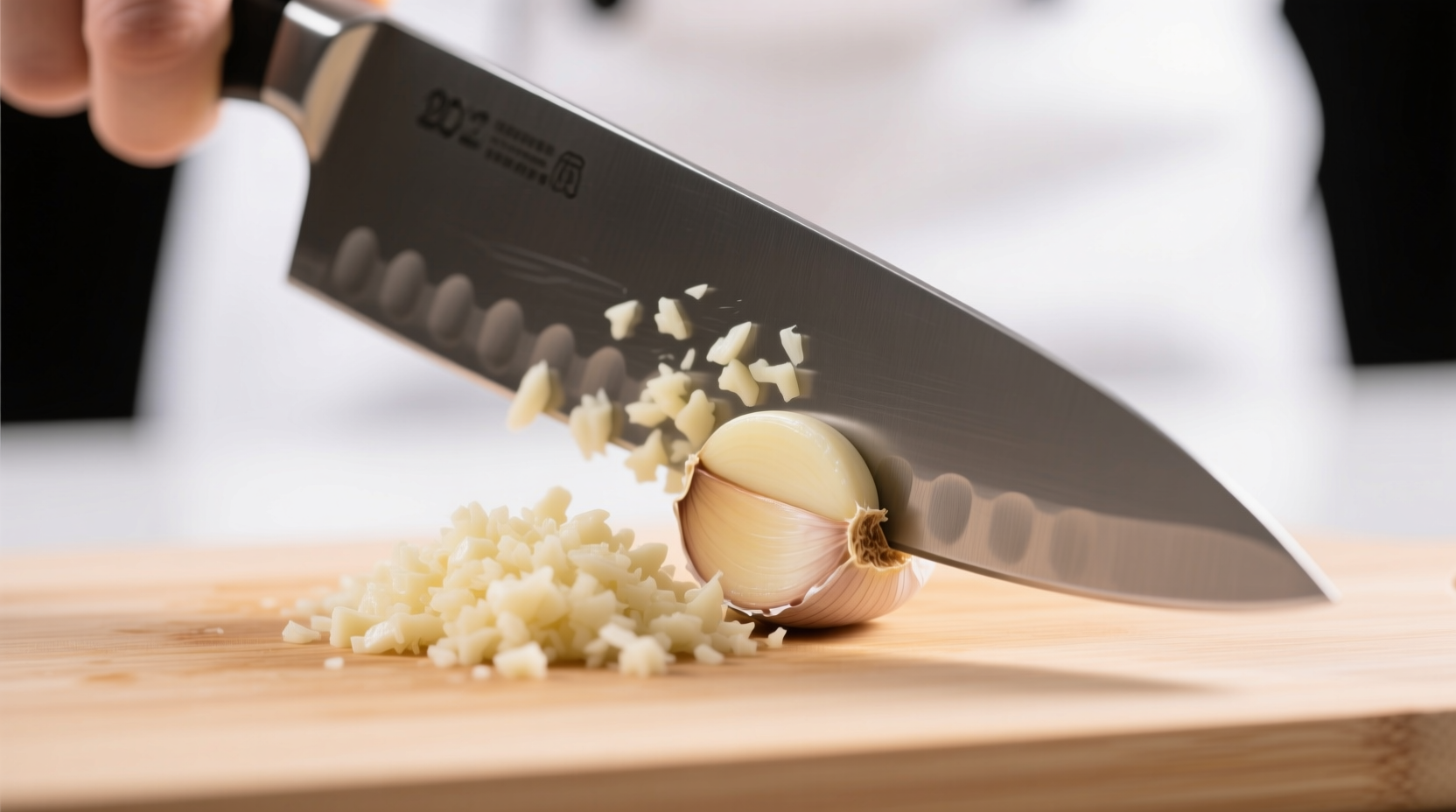 Step-by-step garlic mincing: flattening clove with knife, rough chop, rocking motion, final minced pile