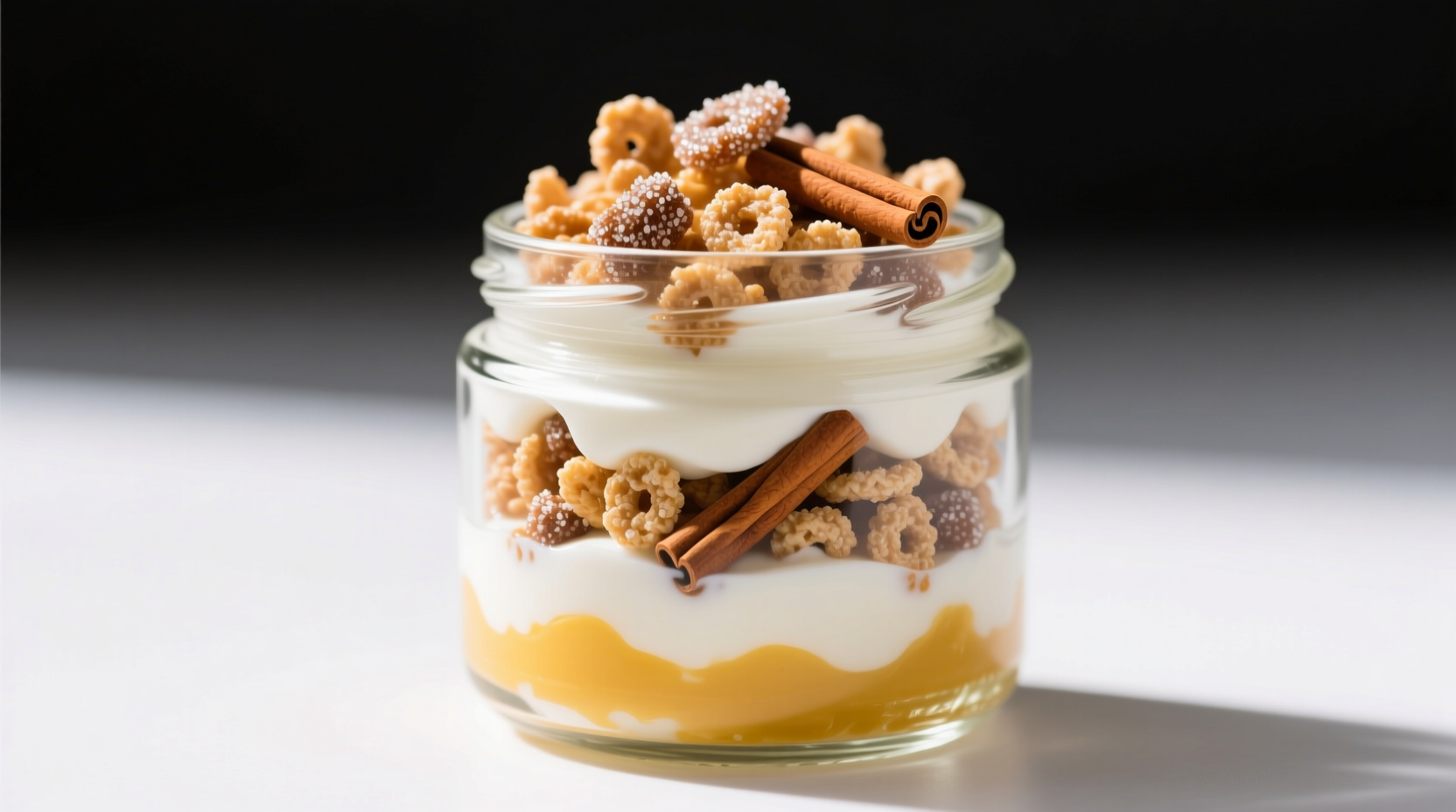 Yogurt parfait with distinct layers of Greek yogurt and Cinnamon Toast Crunch