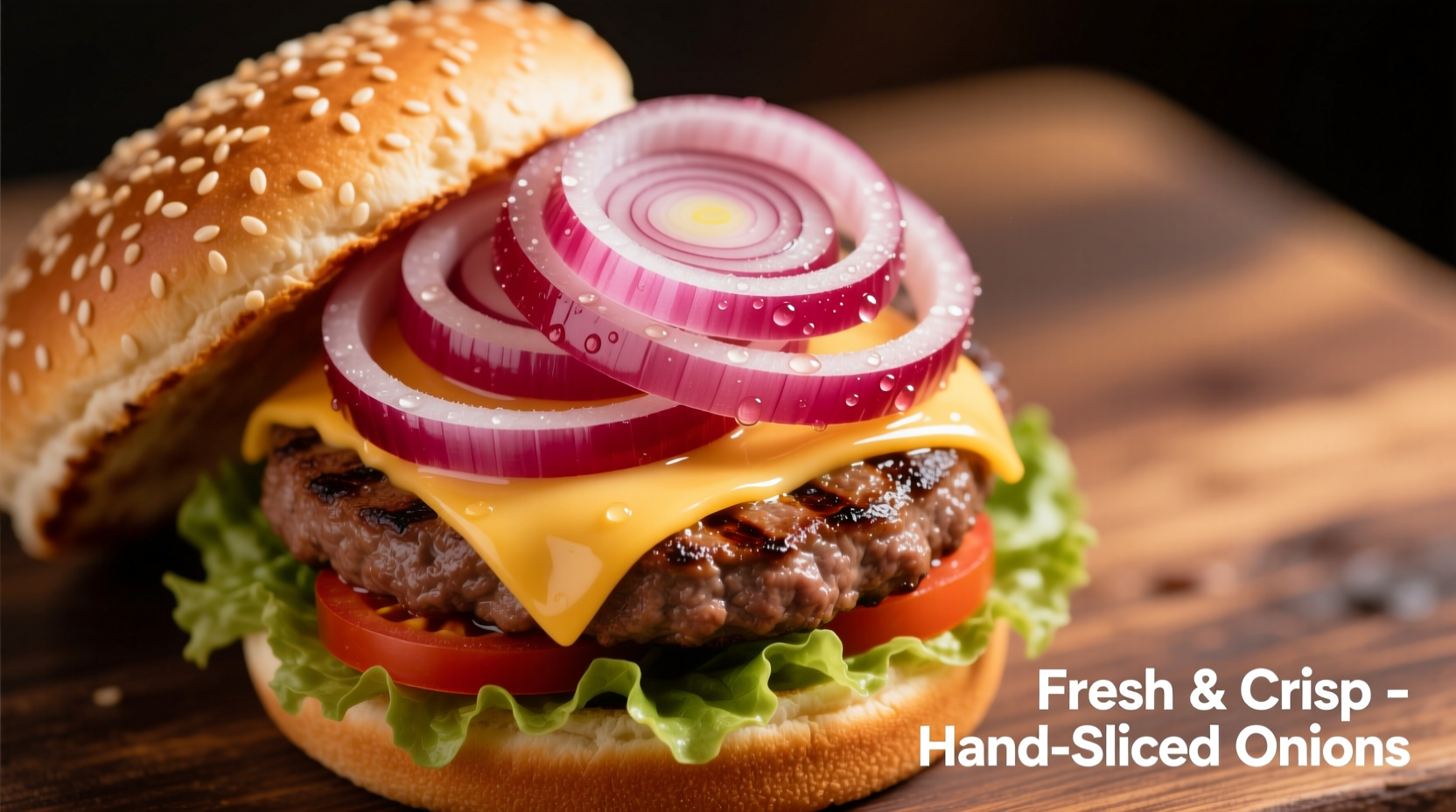 Thinly sliced red onions on fresh burger