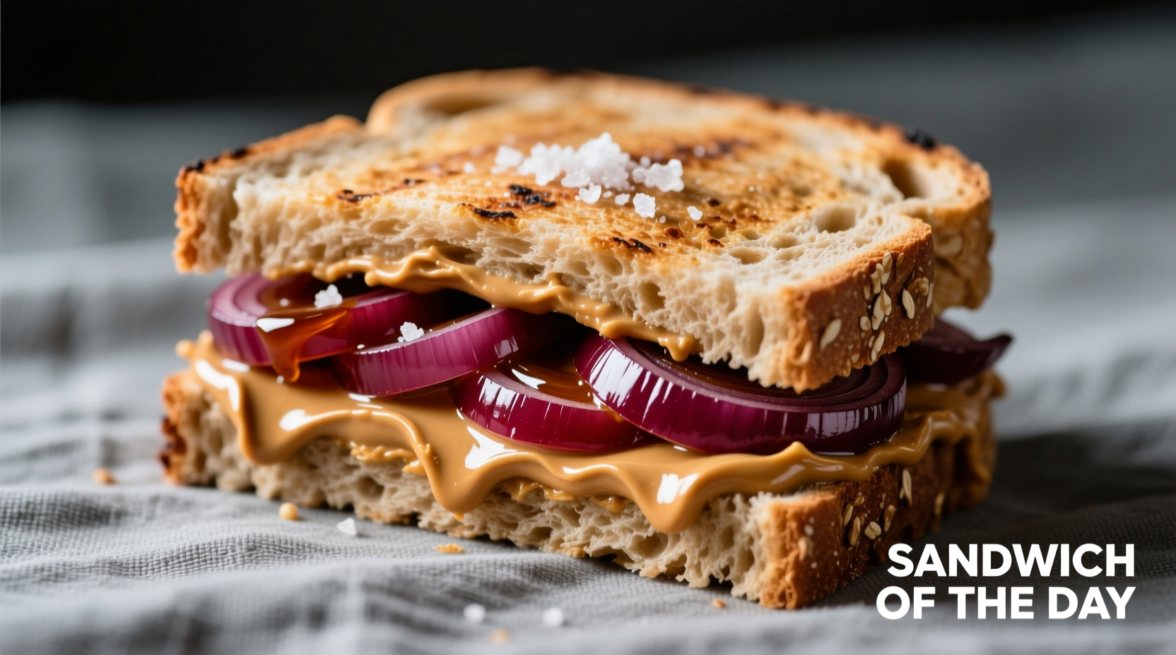 Peanut butter and red onion sandwich on whole wheat bread