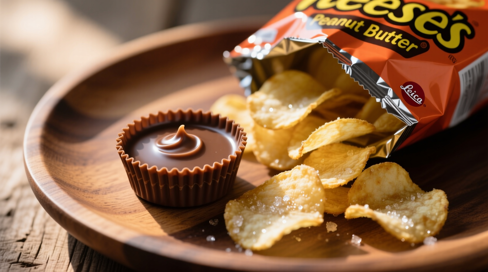 Reese's peanut butter cup next to potato chips on plate