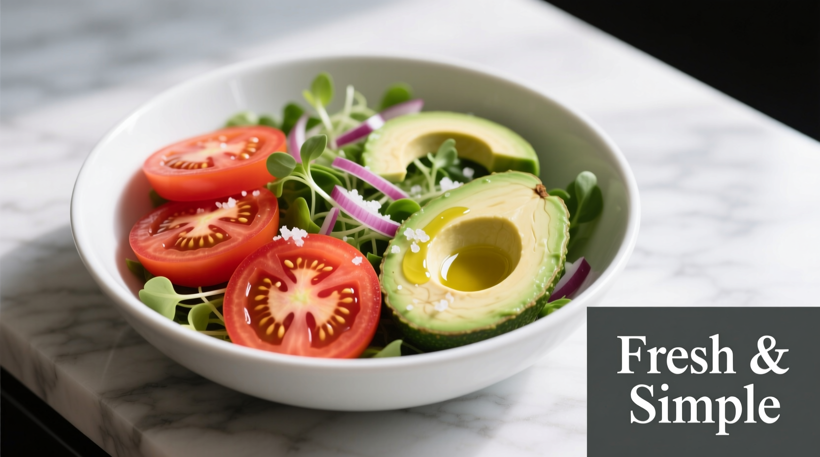 Fresh tomato avocado salad in white bowl