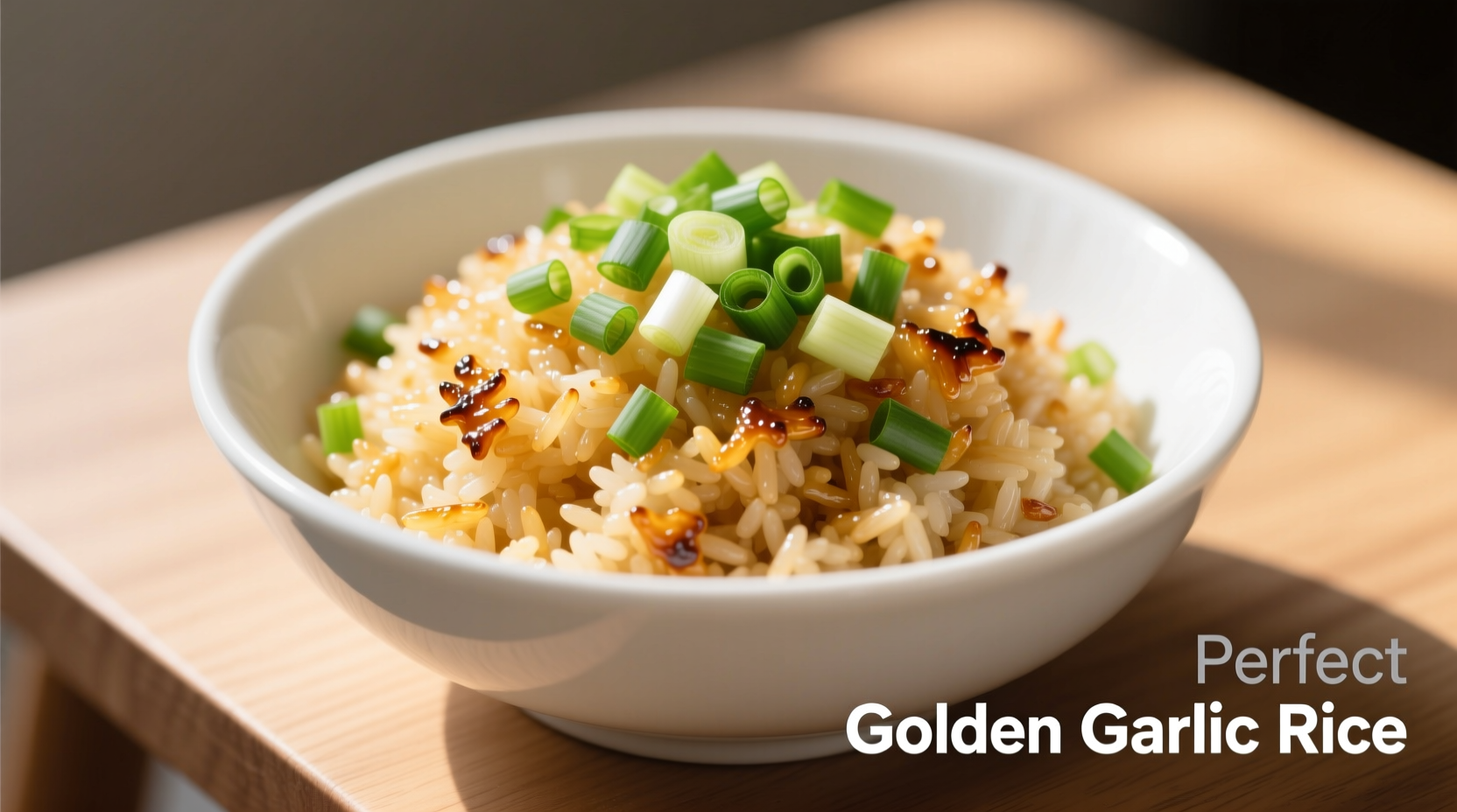 Perfect golden garlic rice in white bowl with green onions