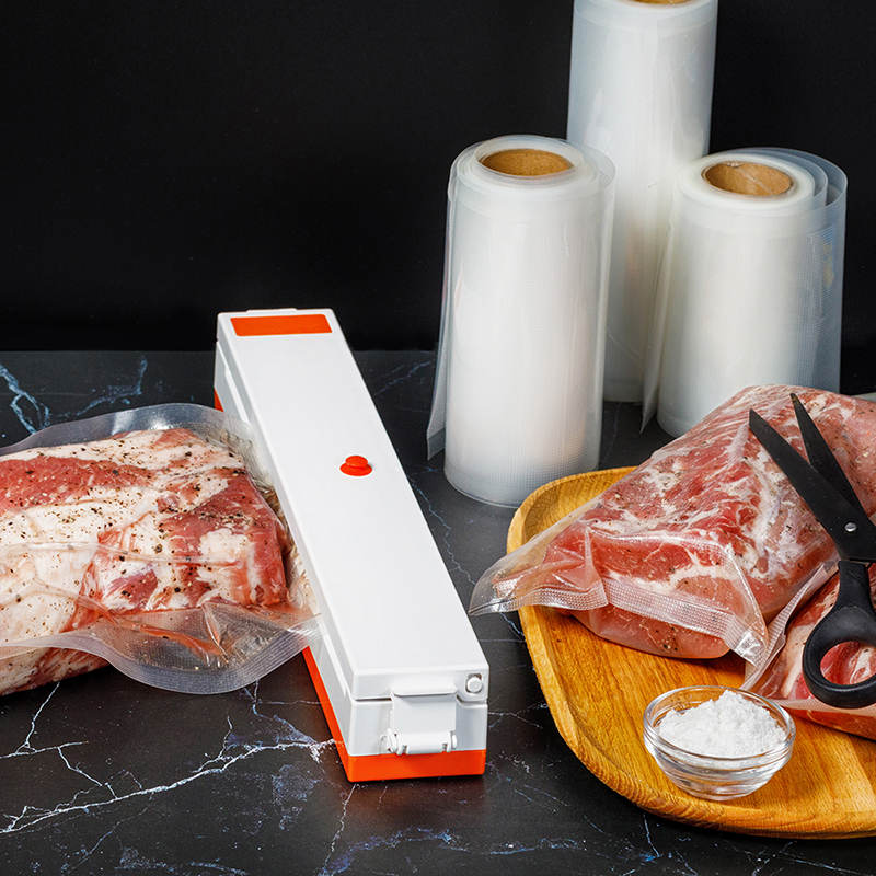 BPAの自由な浮彫りにされた真空のシーラーは凍結する肉食糧貯蔵袋の透明なヒート シールの注文の包装の浮彫りになる袋のためのロールを袋に入れる