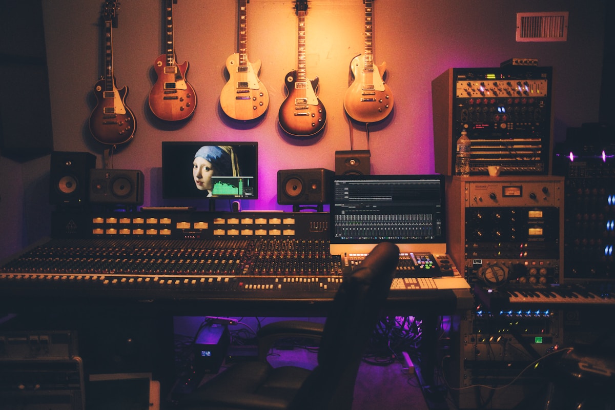 Professional recording studio with mixing console and monitors