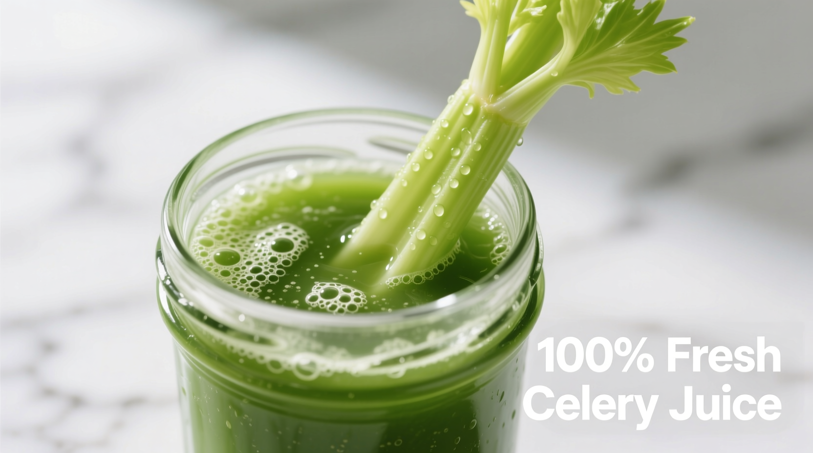 Fresh celery juice in glass with celery stalk