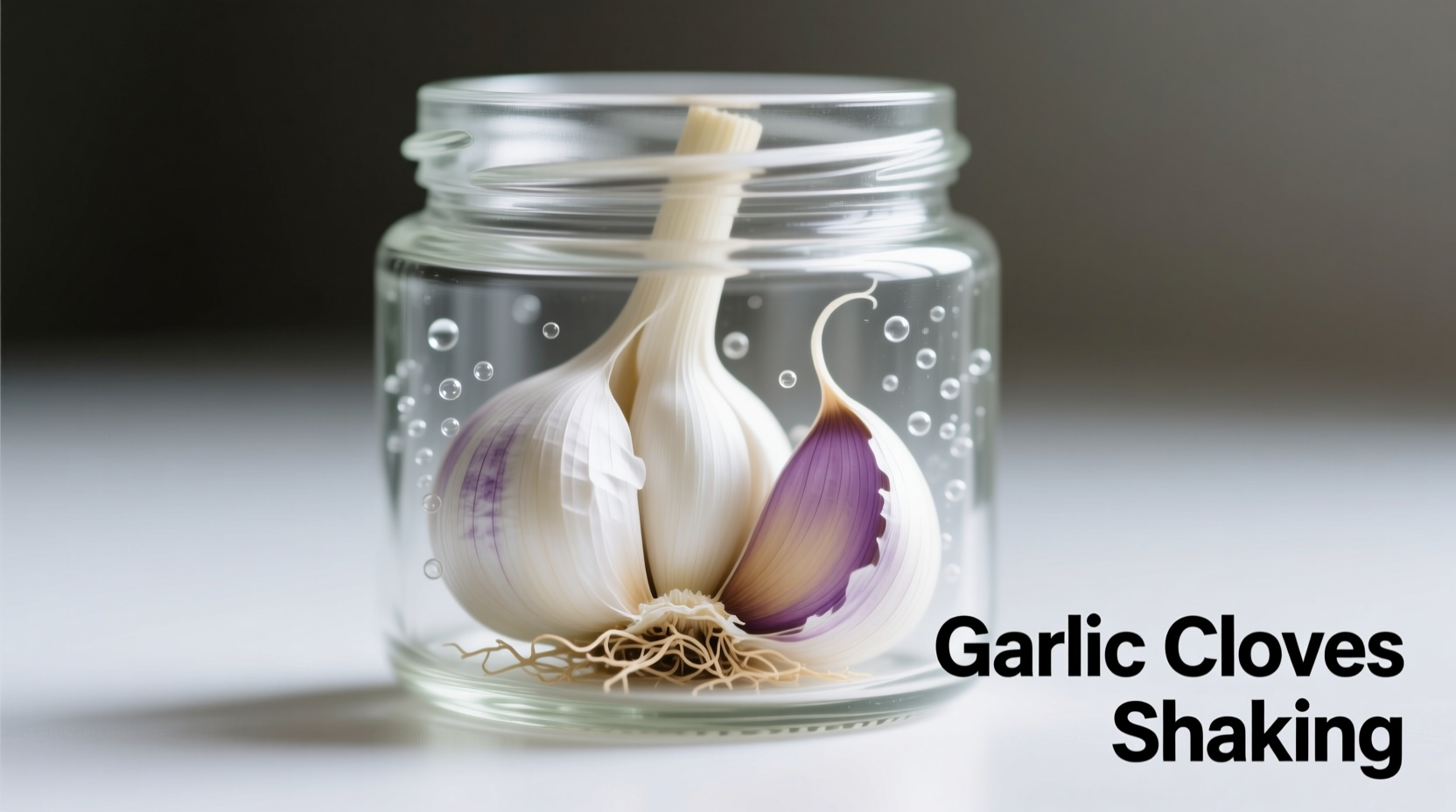 Garlic cloves shaking in sealed glass jar