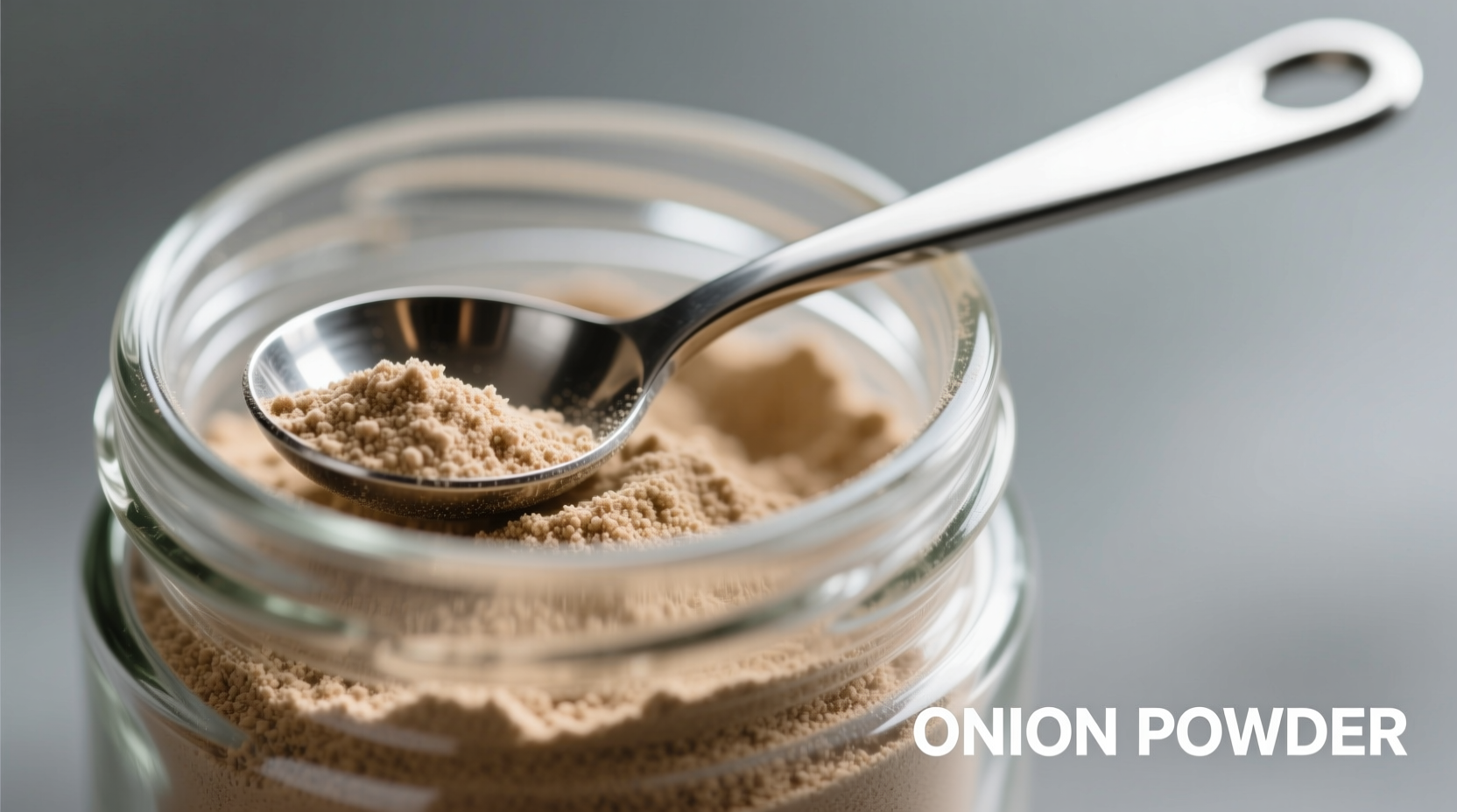 Close-up of onion powder in glass jar with measuring spoon