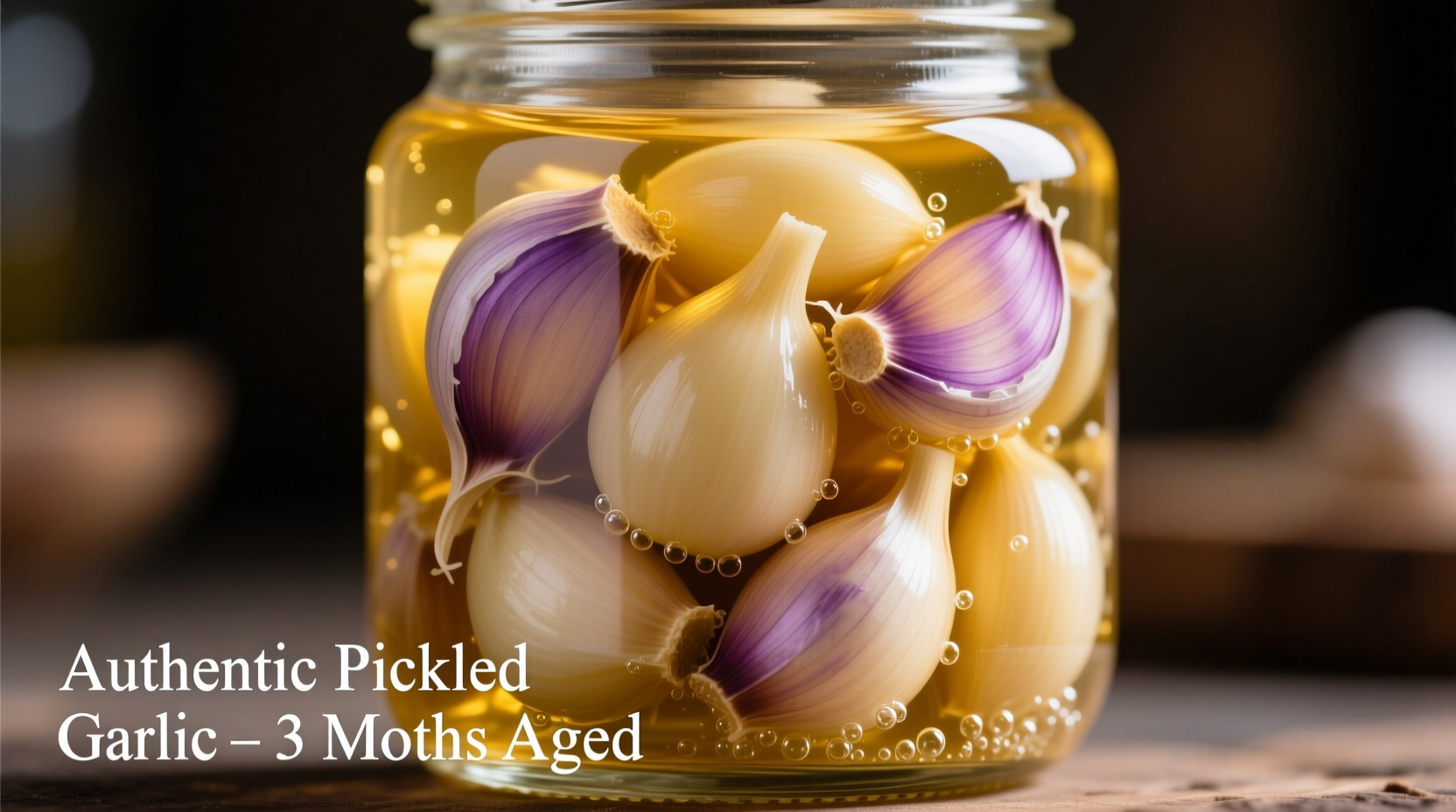 Close-up of pickled garlic cloves in mason jar