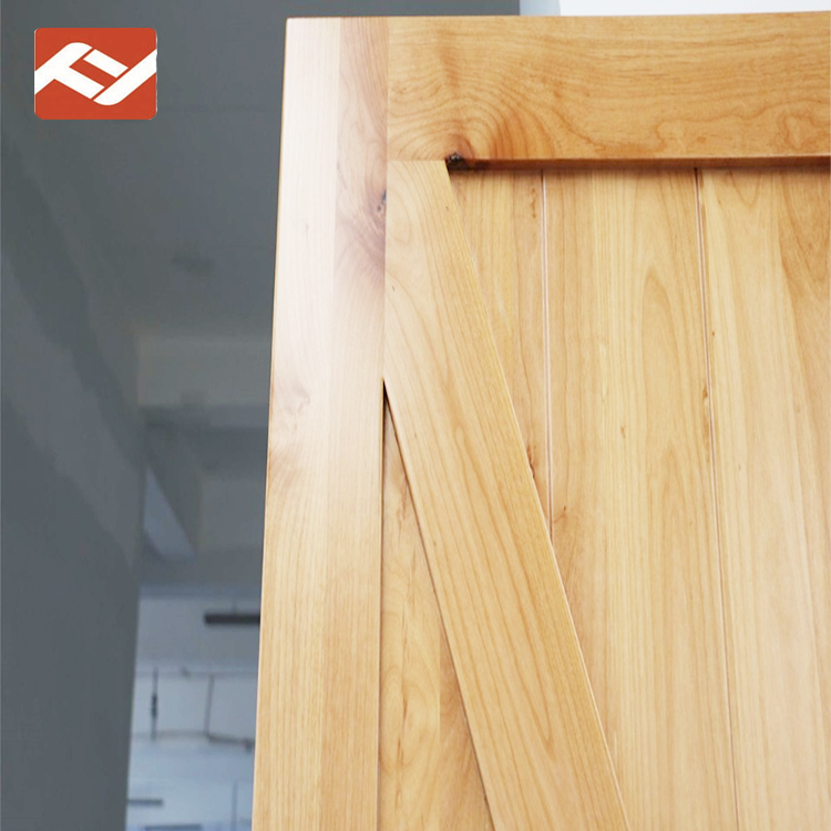 Rustic pine stile & rail stained wood interior barn door with flat panels
