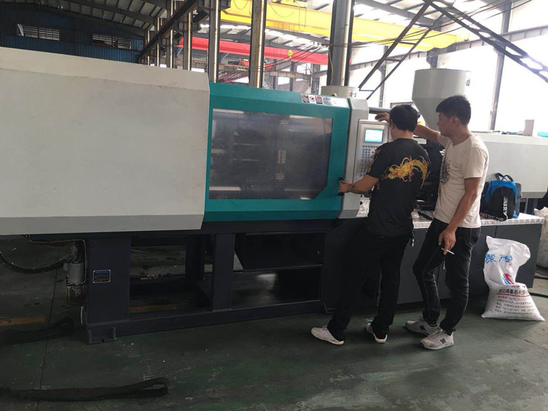 Disposable syringe making machine