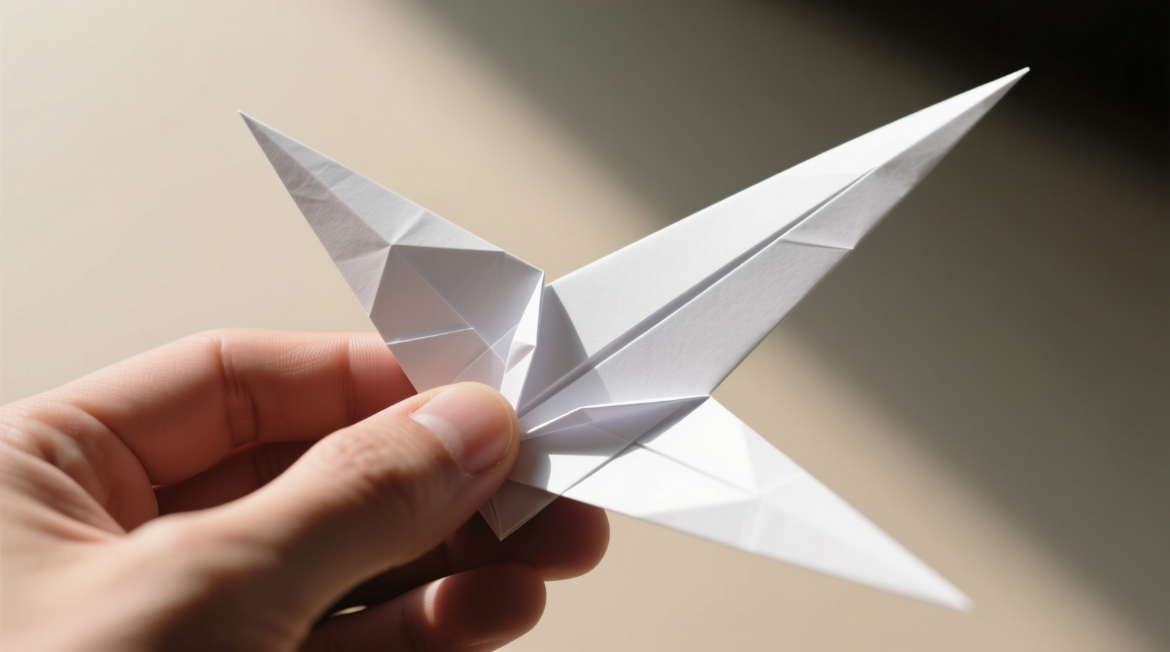 Tucking inner flaps to form dual sharp points of paper kunai