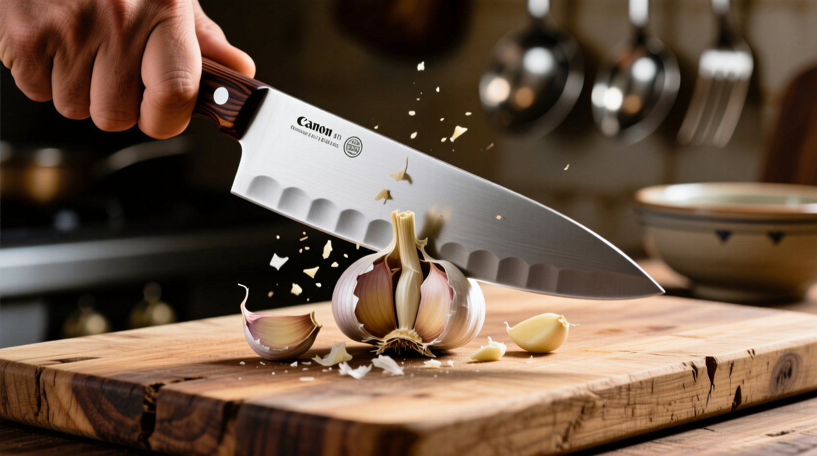 Chef's knife crushing garlic on wooden cutting board