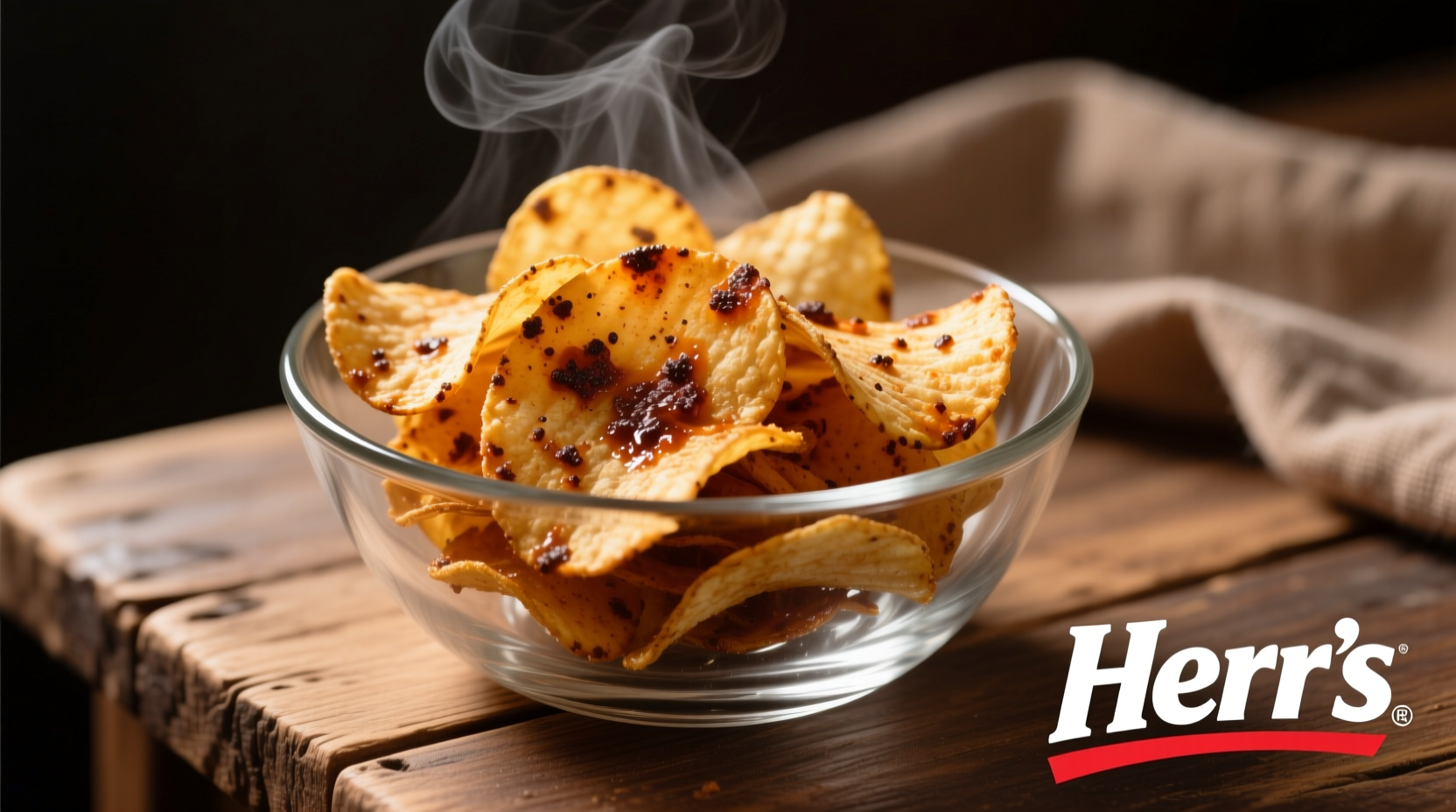Herr's barbecue potato chips in clear bowl